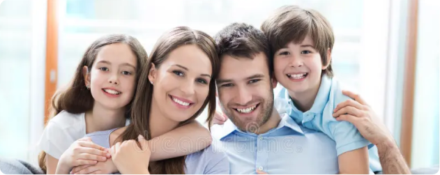 Smiling family relaxing on a couch